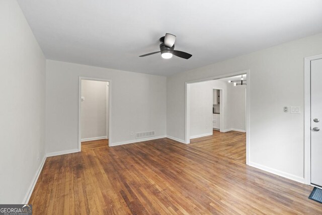 spare room featuring hardwood / wood-style floors and ceiling fan