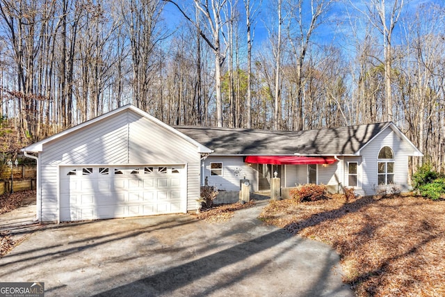 ranch-style home featuring a garage