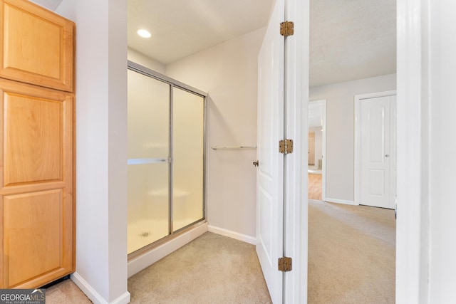 bathroom with an enclosed shower