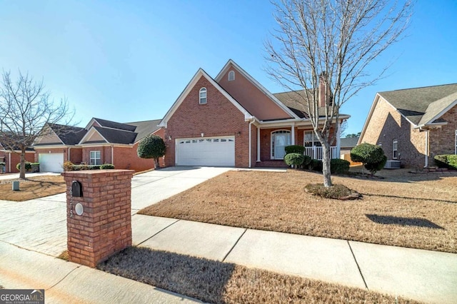 view of front of house featuring a garage and central AC