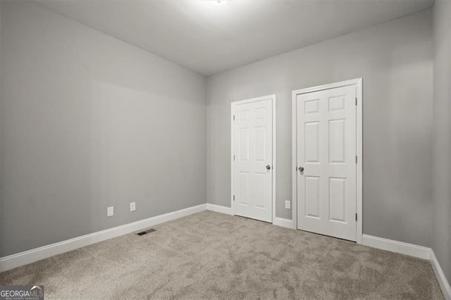 unfurnished bedroom featuring carpet floors