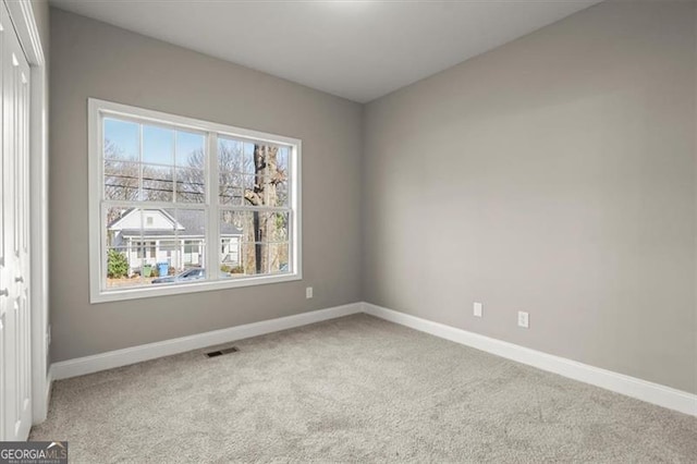 view of carpeted spare room