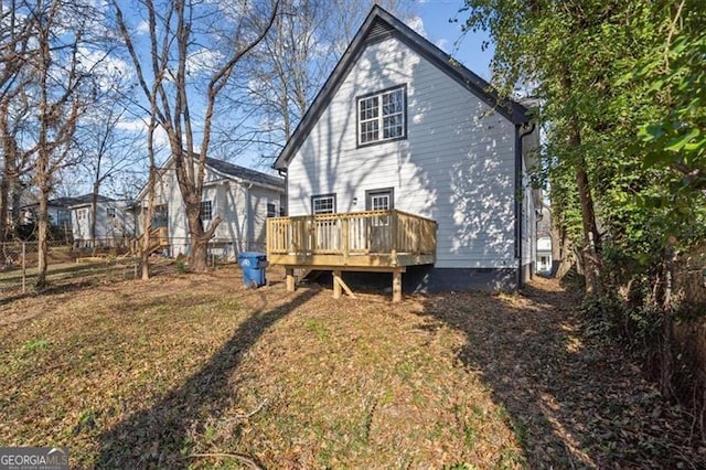 rear view of property with a deck