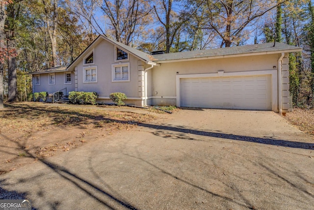 ranch-style home featuring a garage