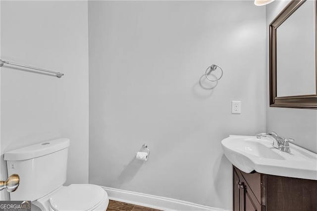 bathroom with tile patterned floors, vanity, and toilet