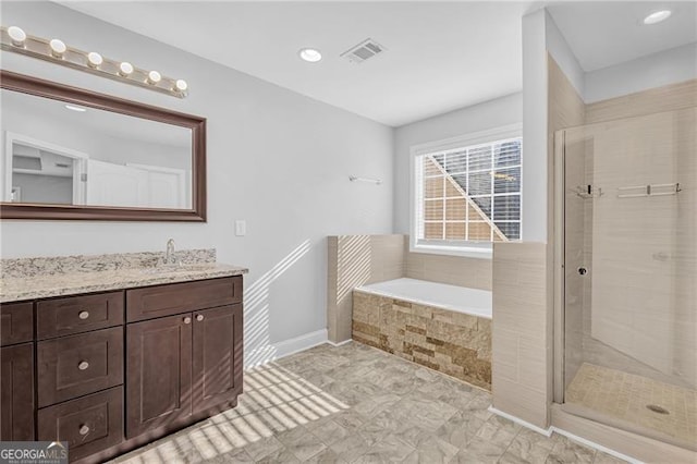 bathroom with plus walk in shower and vanity