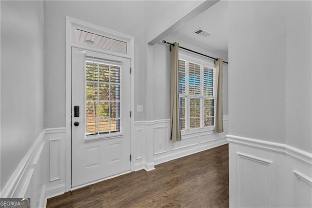 doorway featuring dark wood-type flooring