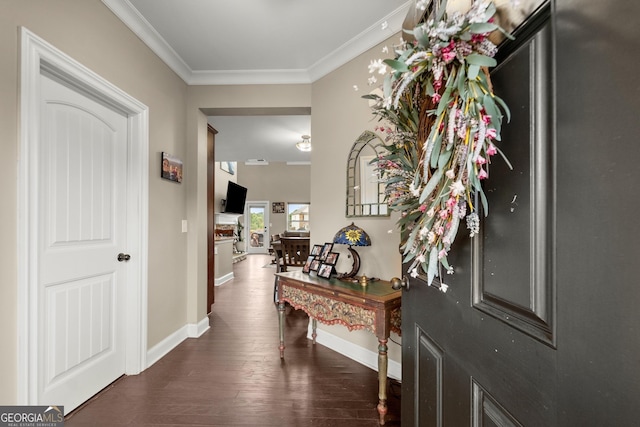 entryway with dark hardwood / wood-style floors and crown molding