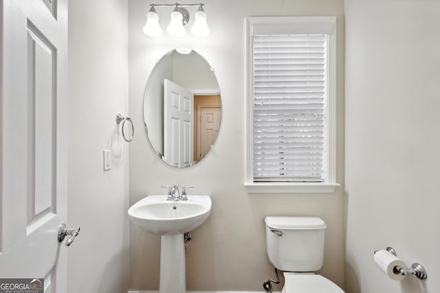 bathroom with toilet and sink