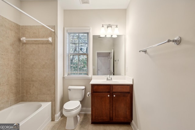 full bathroom with toilet, vanity, tile patterned floors, and tiled shower / bath