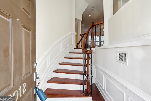 stairway featuring hardwood / wood-style floors