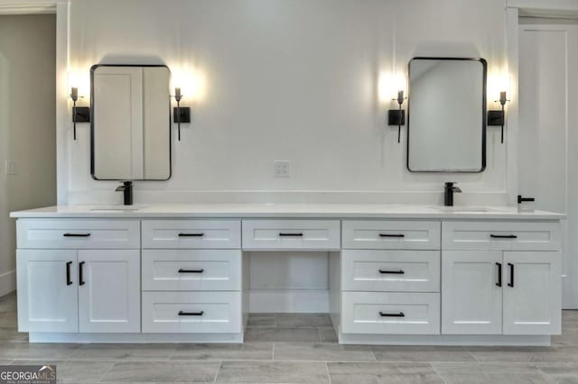 bathroom with double vanity and a sink