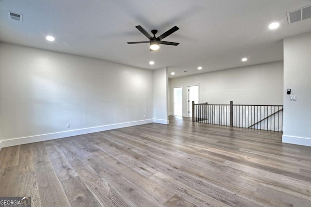 empty room with recessed lighting, visible vents, wood finished floors, and a ceiling fan