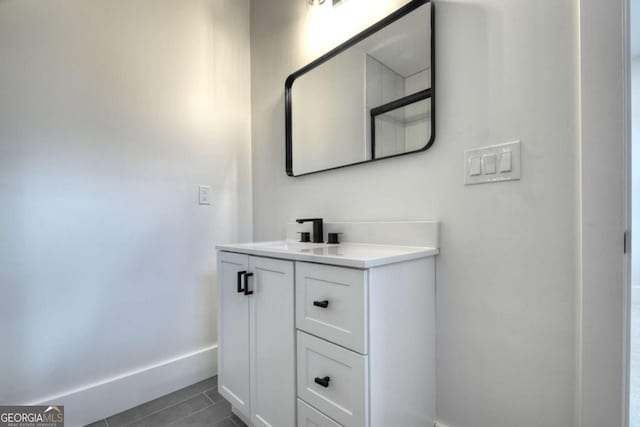 bathroom featuring vanity and baseboards