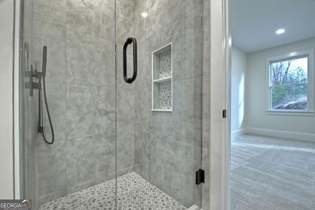 full bathroom featuring recessed lighting, baseboards, and a stall shower