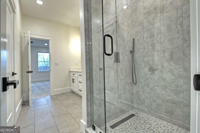 full bath with tile patterned floors, a stall shower, recessed lighting, baseboards, and vanity