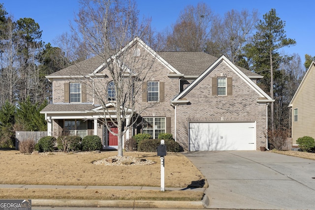 front of property with a garage