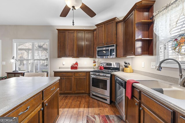 home office with hardwood / wood-style floors and ceiling fan