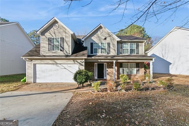 view of front of home with a porch and a garage