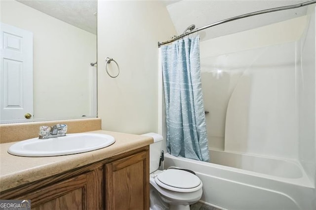 full bathroom featuring shower / bath combo with shower curtain, vanity, and toilet