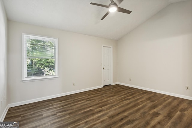 empty room with ceiling fan, dark hardwood / wood-style flooring, and lofted ceiling