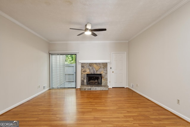 unfurnished living room with crown molding, a fireplace, and light wood-type flooring