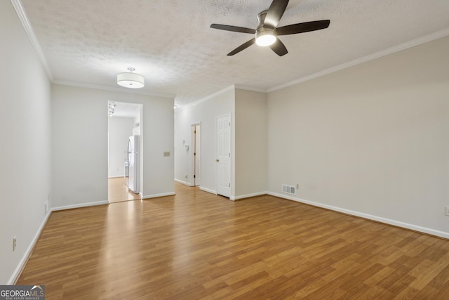 unfurnished room featuring ceiling fan, crown molding, a textured ceiling, and light hardwood / wood-style flooring