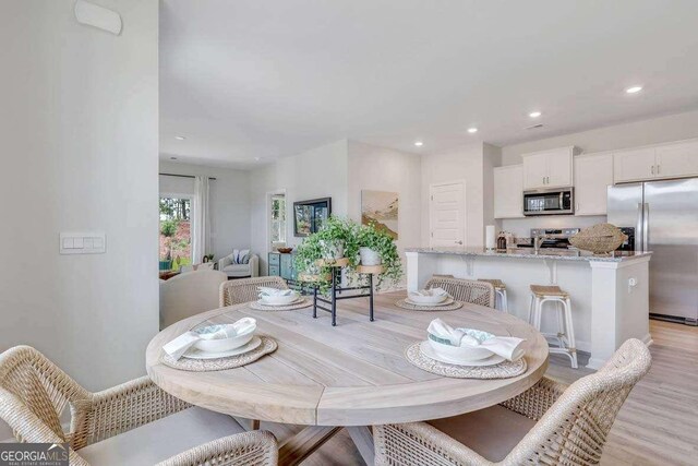 dining area featuring light hardwood / wood-style floors