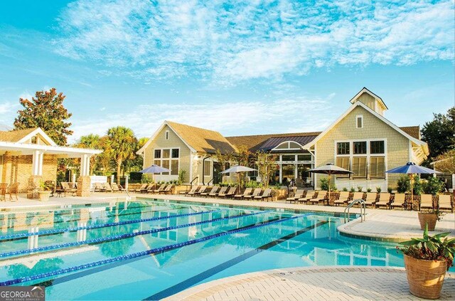 view of swimming pool featuring a patio