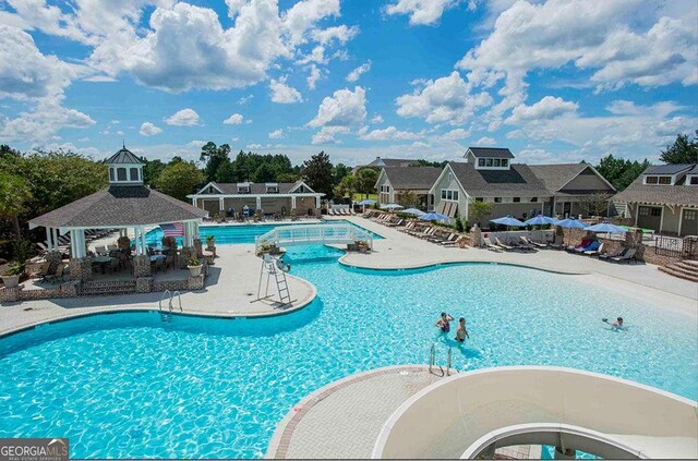 view of pool featuring a gazebo and a patio