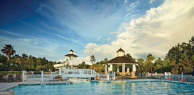 view of swimming pool with a gazebo