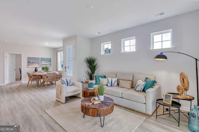 living room with light hardwood / wood-style floors