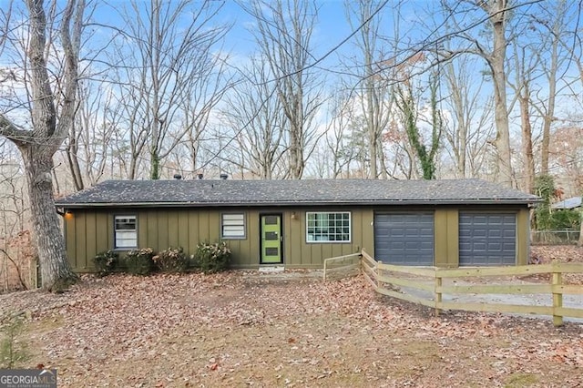 ranch-style home featuring a garage