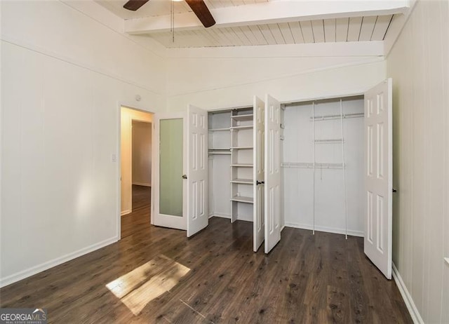 unfurnished bedroom featuring vaulted ceiling with beams, ceiling fan, wood ceiling, and dark hardwood / wood-style floors