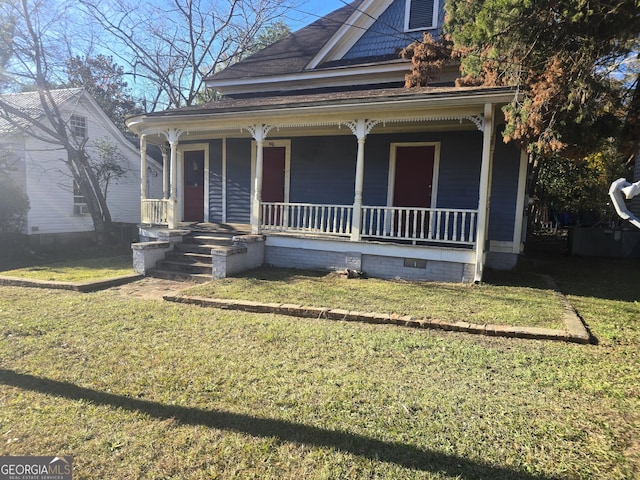 view of front of home featuring a front yard and a porch