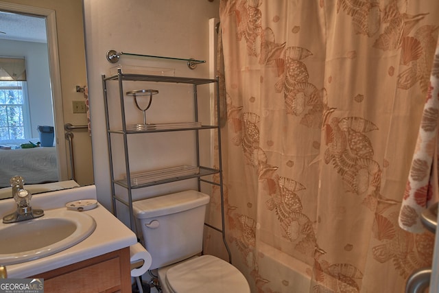 full bathroom featuring vanity, toilet, and shower / tub combo