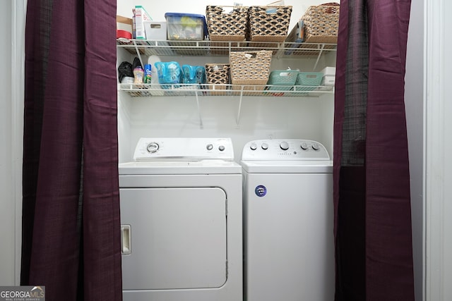 washroom with washer and clothes dryer