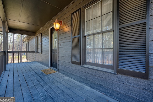 wooden deck featuring covered porch