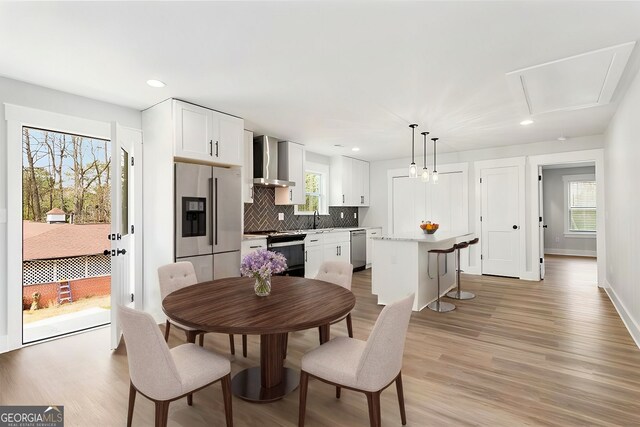 interior space featuring recessed lighting, wood finished floors, and baseboards