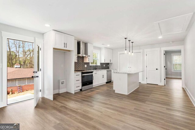 dining area featuring attic access, recessed lighting, light wood-style flooring, and baseboards