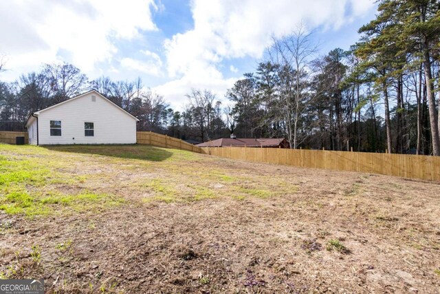 view of yard featuring a fenced backyard