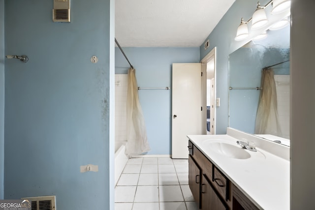 bathroom featuring shower / tub combo with curtain, vanity, and tile patterned flooring