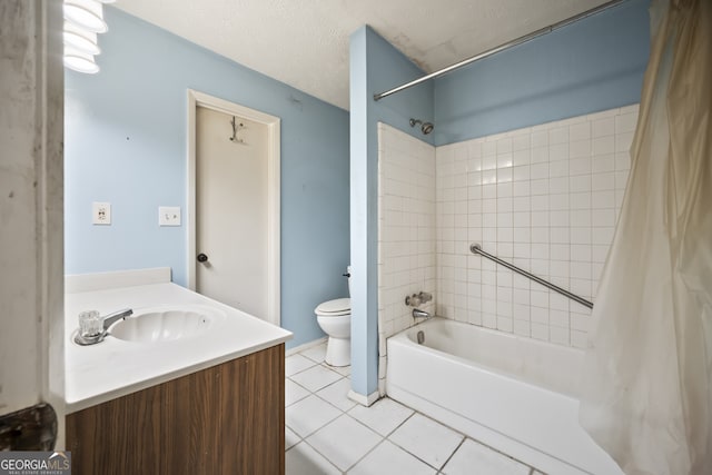 full bathroom with tile patterned floors, vanity, a textured ceiling, shower / bath combo with shower curtain, and toilet