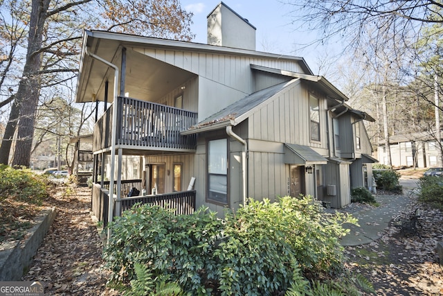 back of property featuring a balcony