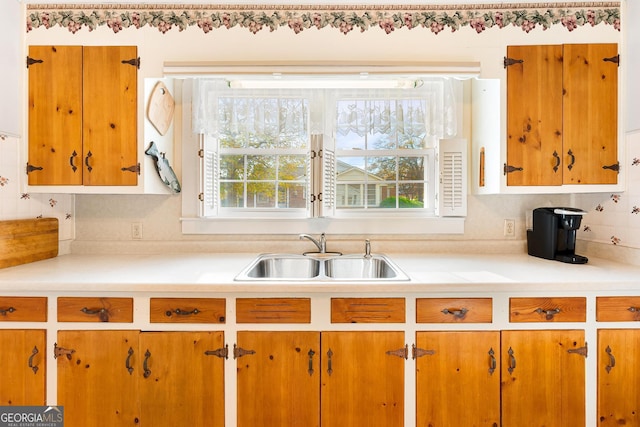 kitchen with decorative backsplash and sink