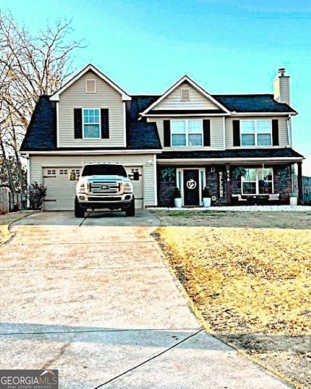 410 Tori Dr, Winder, GA 30680 - view of front of property featuring a porch and a garage