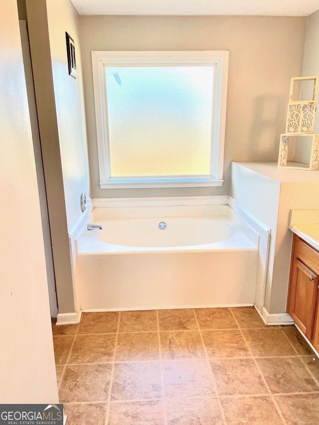 bathroom featuring a tub and vanity