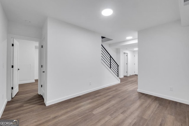 empty room with hardwood / wood-style flooring