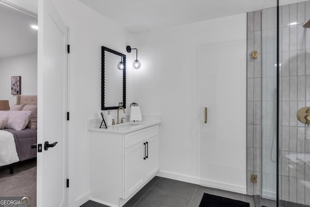 bathroom with tile patterned floors, vanity, and an enclosed shower