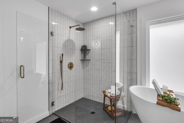 bathroom with independent shower and bath